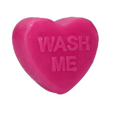 Bright pink heart-shaped soap bar with the words "WASH ME" embossed on the front.