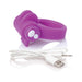 Purple silicone vibrating ring with USB charging cable on white background.