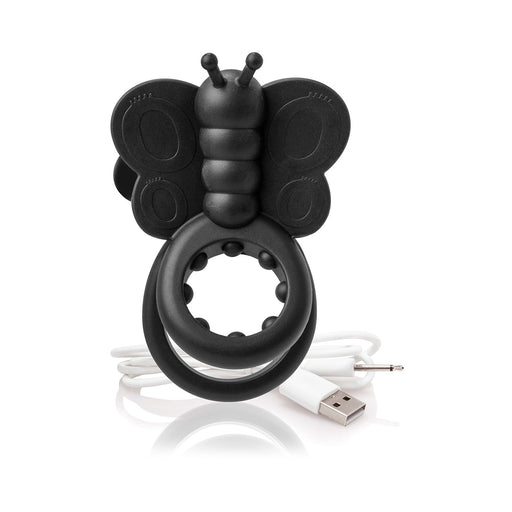 Black silicone butterfly-shaped wearable vibe with dual rings and USB charging cable on white background.