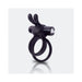 Black wearable rabbit vibrator ring with dual vibrating ears and dual rings on a reflective surface