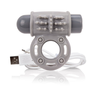 Gray vibrating ring with textured surface and USB charging cable on white background