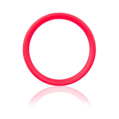Bright red flexible silicone ring with smooth surface and reflective shadow on white background.