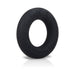 Black liquid silicone cock ring with embossed branding, smooth texture and round shape on white background.