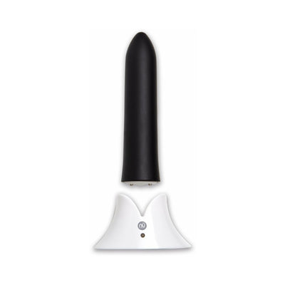 Black silicone bullet vibrator with tapered tip standing on a white magnetic USB charging base.