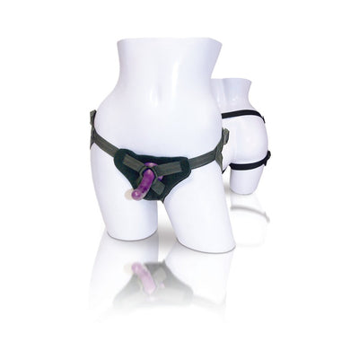 Two white mannequin torsos displaying adjustable black strap-on harnesses with a slender purple silicone dildo attached.