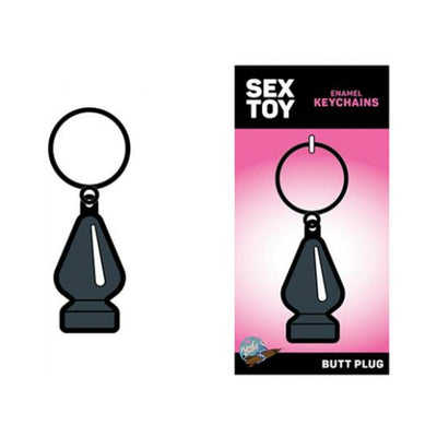 Gray enamel keychain shaped like a small butt plug on a pink and black backing card labeled Sex Toy Keychains.