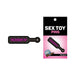 Black enamel pin shaped like a paddle with the word kinky in pink, displayed on branded packaging.
