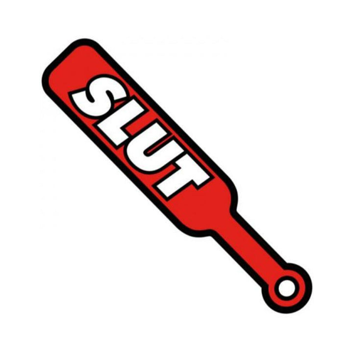 Red enamel lapel pin shaped like a paddle with the word "SLUT" in bold white letters.