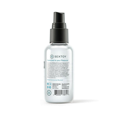 Clear 4 oz spray bottle of Sextoy Body & Toy Cleaner with black pump and product information on label.