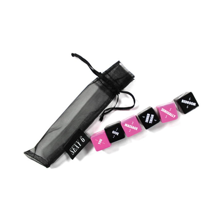 Set of six pink and black dice with romantic actions and body parts, displayed next to a black organza drawstring bag.