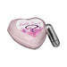 Heart-shaped pink bath bomb labeled Sexy Surprise with a small silver bullet vibrator beside it.
