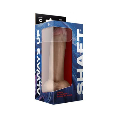 Packaged Shaft Model C liquid silicone dildo with balls in pine color, featuring realistic texture and suction base.