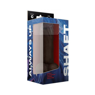 Packaged Shaft Model C realistic dildo in mahogany with suction base, displayed in blue and white branded box.