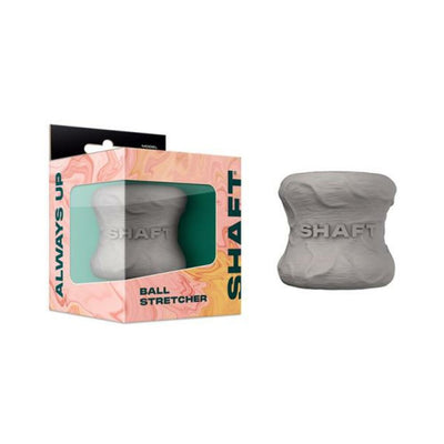 Gray flexible silicone ball stretcher with embossed Shaft logo and colorful packaging box.