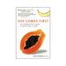 Cover of the book She Comes First by Ian Kerner featuring a papaya and a banana illustration on a white background.