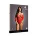 Plus size model wearing red lace crotchless teddy with 3/4 sleeves on product packaging for Le Désir collection.