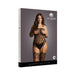 Packaging of Shots Le Desir strapless crotchless teddy with attached stockings shown on model against gray background