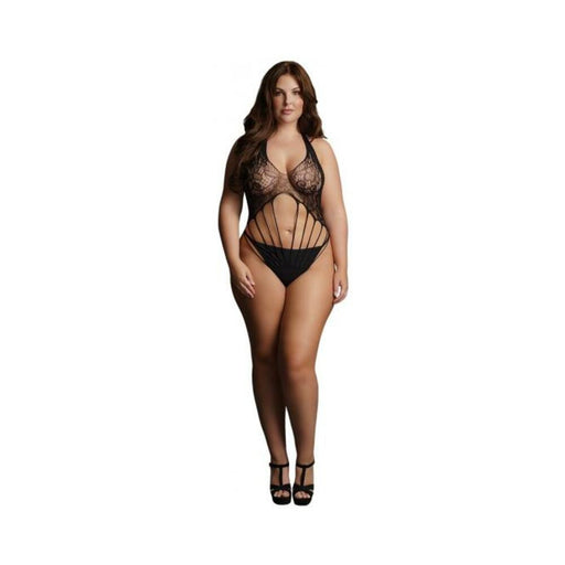 Plus-size model wearing black strappy lace teddy with halter neck and cut-out design, paired with black heels.
