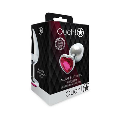 Packaging box of Ouch! medium silver metal butt plug with a pink heart-shaped gem base.