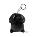 Black plush keychain with a smiling face and blue eyes, designed as a playful novelty gift accessory.