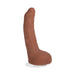 Caramel-colored realistic ULTRASKYN dildo with suction cup base and lifelike texture.