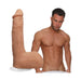 Realistic 8-inch Ultraskyn dildo with suction cup next to a shirtless male model showcasing size and detail.