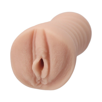Handheld Adira Allure Ultraskyn pocket stroker in natural skin tone with realistic texture and detailed design.