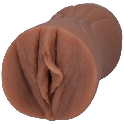 Compact lifelike pocket-sized ULTRASKYN stroker in natural skin tone with detailed texture.