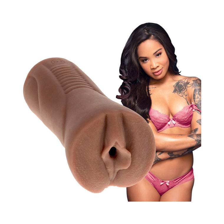 Honey Gold Signature Strokers pocket pussy in lifelike Ultraskyn material with model in pink lingerie background.
