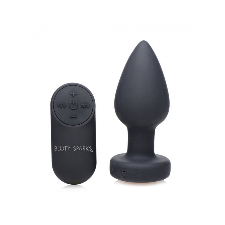 Black silicone vibrating plug with tapered tip and matching remote control with multiple function buttons.
