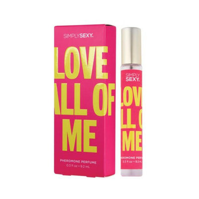 Simply Sexy Love All Of Me pheromone body mist in bright pink packaging with bold yellow text and gold cap spray bottle.
