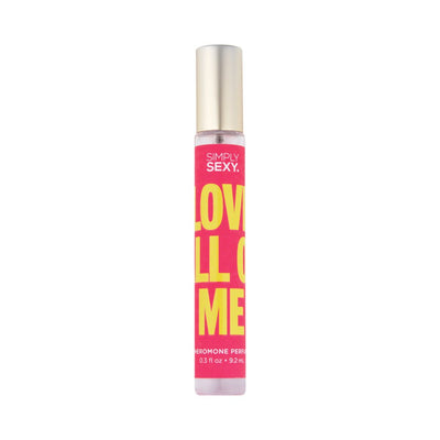 Slim roll-on pheromone perfume bottle with bright pink and yellow label reading Love All Of Me, gold cap, 0.3 fl oz size.