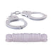Silver metal handcuffs with keys and a neatly coiled white cotton rope on a white background.