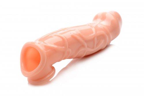 Beige 2-inch penis extender sleeve with realistic texture and dual openings for penis and scrotum, made of body-safe TPR material.