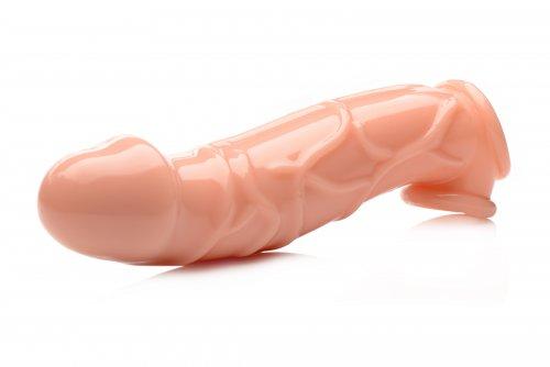 Beige 2-inch penis extender sleeve with realistic texture and curved shape for enhanced internal stimulation.