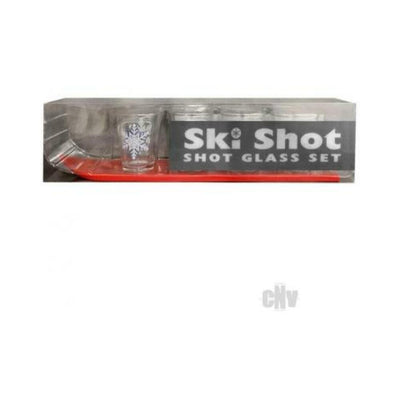 Ski Shot 4-piece shot glass set with clear glasses featuring snowflake design on a red ski-shaped holder in packaging.