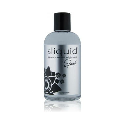 Bottle of Sliquid Naturals Spark silicone stimulating lubricant with black cap and silver label.