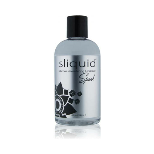 Bottle of Sliquid Naturals Spark silicone stimulating lubricant with black cap and silver label.