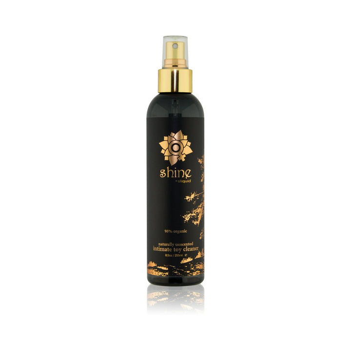 Black and gold 8.5 oz spray bottle of Sliquid Shine organic intimate toy cleaner with floral design on label.