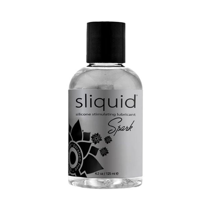 Clear 4.2oz bottle of Sliquid Spark silicone stimulating lubricant with black cap and decorative label design