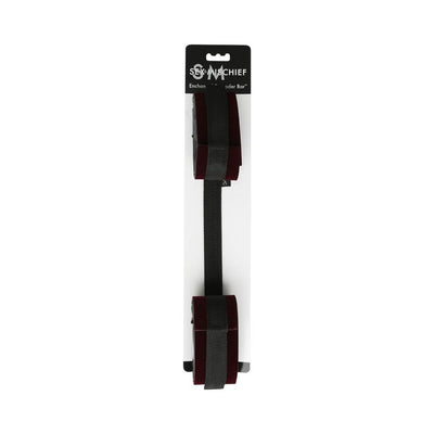 S&M Enchanted Spreader Bar with black adjustable straps and velvety cuffs on white packaging background.