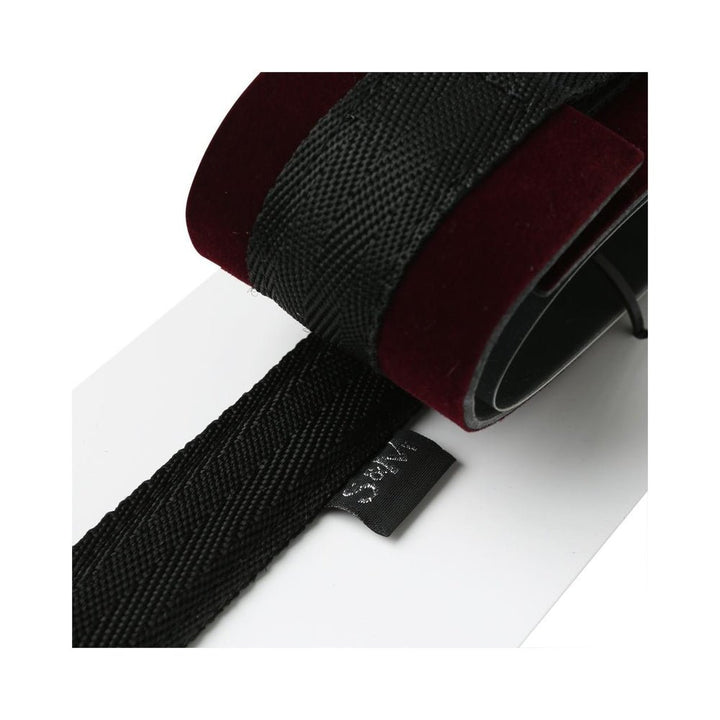 Close-up of black nylon strap and burgundy velvet cuff on S&M Enchanted Spreader Bar for comfortable restraint.