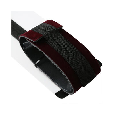 Close-up of a burgundy velvet spreader bar with black adjustable straps and easy-release closures.