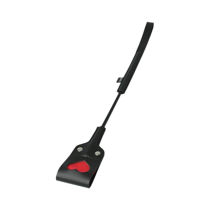 Black S&M crop with a heart-shaped cut-out and red backing, featuring a wrist strap and durable handle.