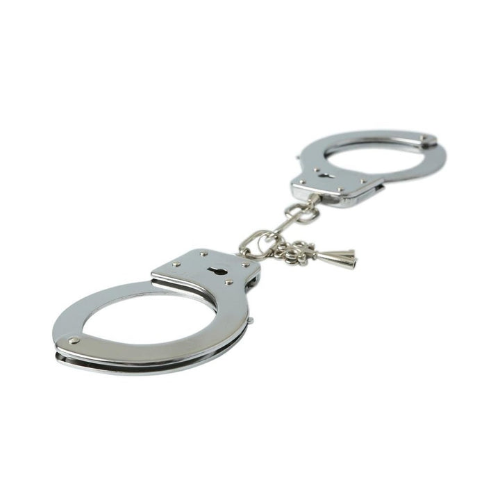 Nickel-free metal handcuffs with locking mechanism and attached keys on a white background.