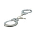 Nickel-free metal handcuffs with locking mechanism and attached keys on a white background.