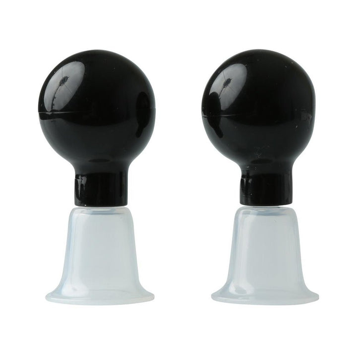 Pair of black bulb-style nipple suckers with clear flanged bases for adjustable suction and secure fit.