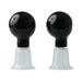 Pair of black bulb-style nipple suckers with clear flanged bases for adjustable suction and secure fit.