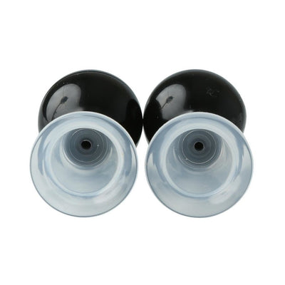 Pair of black and clear silicone nipple suckers with squeezable bulbs and flanged bases for adjustable suction.