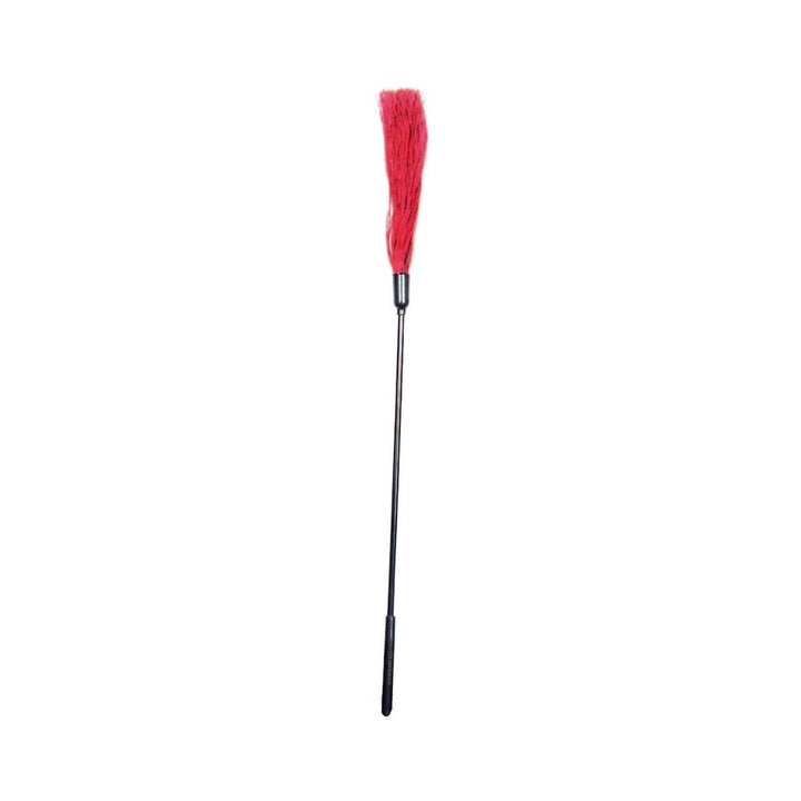 S&M rubber tickler with long black handle and red rubber strands for sensory play and tactile stimulation.